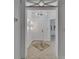 Inviting entryway boasts modern lighting fixtures and stylish tile flooring design detail at 329 Seneca Falls Dr, Apollo Beach, FL 33572