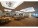 Large event space with multiple chandeliers, tables, and chairs; ready for gatherings and special occasions at 329 Seneca Falls Dr, Apollo Beach, FL 33572