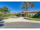Inviting community clubhouse featuring beautiful landscaping and ample parking at 329 Seneca Falls Dr, Apollo Beach, FL 33572