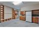 Spacious garage with built-in shelving units and ample storage space with room for multiple cars at 329 Seneca Falls Dr, Apollo Beach, FL 33572