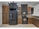 Modern kitchen with custom cabinetry, black appliances, and ample counter space at 329 Seneca Falls Dr, Apollo Beach, FL 33572