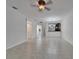 Open-concept living room with views of the kitchen and doorways to other rooms at 329 Seneca Falls Dr, Apollo Beach, FL 33572