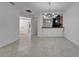 Bright living room showcasing sleek tile flooring, open layout, and modern lighting at 329 Seneca Falls Dr, Apollo Beach, FL 33572