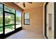 The enclosed patio features a screened exterior wall, neutral paint and concrete flooring at 329 Seneca Falls Dr, Apollo Beach, FL 33572