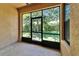 View of enclosed patio with screens, concrete flooring and a view of the backyard at 329 Seneca Falls Dr, Apollo Beach, FL 33572