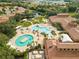Aerial view of the community pool area with lounge chairs and tropical landscaping at 329 Seneca Falls Dr, Apollo Beach, FL 33572