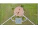 A bird's-eye view of a playground and basketball court, with benches and trees at 33228 Kateland Dr, Wesley Chapel, FL 33545