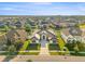 Stunning aerial view of a modern home with manicured lawn in a well-planned community at 33228 Kateland Dr, Wesley Chapel, FL 33545