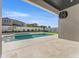 Stunning backyard pool with spa, travertine pavers, landscaping, and privacy fence at 33228 Kateland Dr, Wesley Chapel, FL 33545