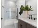 Stylish bathroom featuring modern fixtures, glass-enclosed shower, and contemporary design elements at 33228 Kateland Dr, Wesley Chapel, FL 33545