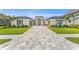 Stunning single story home with tropical landscaping and paver driveway at 33228 Kateland Dr, Wesley Chapel, FL 33545