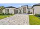 Beautiful single-story home with well manicured lawn and paver driveway at 33228 Kateland Dr, Wesley Chapel, FL 33545