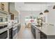 Modern gourmet kitchen with stainless steel appliances, island, and stylish countertops at 33228 Kateland Dr, Wesley Chapel, FL 33545