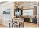 A compact kitchen features dark cabinets, granite countertops, and stainless steel appliances at 33228 Kateland Dr, Wesley Chapel, FL 33545