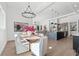 Modern open-concept living space featuring a dining room, kitchen with an island, and a comfortable living room at 33228 Kateland Dr, Wesley Chapel, FL 33545