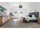 Bright primary bedroom featuring tray ceilings, a large window, and stylish modern finishes at 33228 Kateland Dr, Wesley Chapel, FL 33545