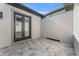 Enclosed paved patio space with direct access to the house, enhancing indoor-outdoor living at 33228 Kateland Dr, Wesley Chapel, FL 33545