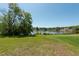 Beautiful backyard with lush green grass and serene waterfront views at 3330 Foxridge Cir, Tampa, FL 33618