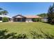A sprawling backyard with mature trees, offering privacy and plenty of space at 3330 Foxridge Cir, Tampa, FL 33618