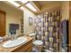 This bathroom features an undermount sink, granite counters, and a shower/tub combo at 3330 Foxridge Cir, Tampa, FL 33618