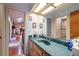 Bathroom with a large mirror, vanity, and view of the living area at 3330 Foxridge Cir, Tampa, FL 33618