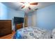 Bedroom with wood floors, a closet, a ceiling fan, and a TV at 3330 Foxridge Cir, Tampa, FL 33618