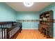 Bedroom with wood floors, fun decor, and a nice desk with shelving at 3330 Foxridge Cir, Tampa, FL 33618