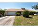 Well-kept home featuring a tidy front yard, garage, and inviting entrance at 3330 Foxridge Cir, Tampa, FL 33618