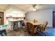 Eat-in kitchen features white cabinets, a breakfast bar, and stainless steel appliances at 3330 Foxridge Cir, Tampa, FL 33618