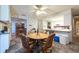 Cozy eat-in kitchen with a round table, chairs, breakfast bar, and views into other rooms at 3330 Foxridge Cir, Tampa, FL 33618