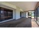 The covered and screened lanai provides a comfortable outdoor space overlooking the backyard at 3330 Foxridge Cir, Tampa, FL 33618