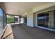 Covered lanai offers an outdoor living space with view to the lake at 3330 Foxridge Cir, Tampa, FL 33618