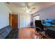 Office with wood floors, closet, a ceiling fan, and a comfortable seating area at 3330 Foxridge Cir, Tampa, FL 33618