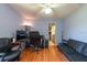 Home office featuring wood floors, a desk, and a comfortable seating area at 3330 Foxridge Cir, Tampa, FL 33618