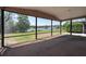 Screened-in porch with tranquil views of a serene lake at 3330 Foxridge Cir, Tampa, FL 33618