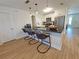 Kitchen with granite countertop island with seating, stainless steel appliances, and modern lighting at 4505 Alligator Dr, New Port Richey, FL 34653