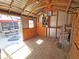 Inside the shed, showing wooden construction, shelving, and natural light at 4505 Alligator Dr, New Port Richey, FL 34653