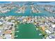 High angle aerial view showcasing waterfront homes, with docks and boat lifts at 455 115Th Ave, Treasure Island, FL 33706