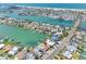 A captivating aerial view of a waterfront community, featuring stunning water views at 455 115Th Ave, Treasure Island, FL 33706