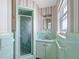 Charming retro bathroom with unique tilework, sink, and shower at 455 115Th Ave, Treasure Island, FL 33706