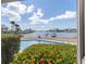 Inviting pool area with lush landscaping and picturesque waterfront views at 455 115Th Ave, Treasure Island, FL 33706