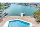 Backyard featuring a private pool, boat dock and waterfront access to the intercoastal at 455 115Th Ave, Treasure Island, FL 33706