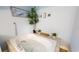 Large soaking tub with jets is nestled in an alcove and decorated with various plants and nature pictures at 5005 Puritan Rd, Tampa, FL 33617