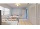 Bedroom with a ceiling fan, a bed, and white closets with tile flooring at 5005 Puritan Rd, Tampa, FL 33617