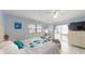 Main bedroom with ceiling fan, white tile floor, and sliding glass doors to enclosed patio and pool at 5005 Puritan Rd, Tampa, FL 33617