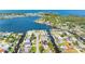 An aerial view highlights the property's location in a waterfront community with easy access to canals and open water at 5425 Bluepoint Dr, Port Richey, FL 34668