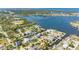 Aerial view showcases the waterfront property with a canal and neighborhood, providing a sense of location and community at 5425 Bluepoint Dr, Port Richey, FL 34668