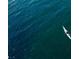 Aerial view of a white kayak in beautiful blue ocean water on a sunny day at 5425 Bluepoint Dr, Port Richey, FL 34668