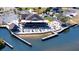 Stunning aerial view of waterfront restaurant with outdoor seating and docks along the water, perfect for scenic dining at 5425 Bluepoint Dr, Port Richey, FL 34668