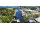 An aerial shot of a canal neighborhood with docks and boat lifts providing direct access to the open waters at 5425 Bluepoint Dr, Port Richey, FL 34668